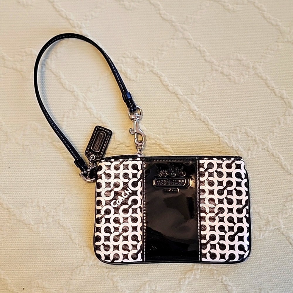 Coach black and white wristlet